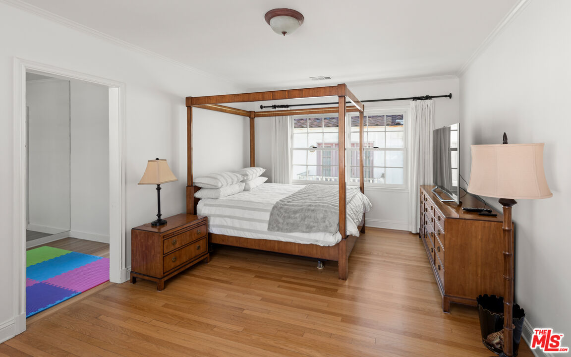 605 Palisades Beach Road Santa Monica, CA 90402 - Photo 24 of 33 a bedroom with furniture and a window