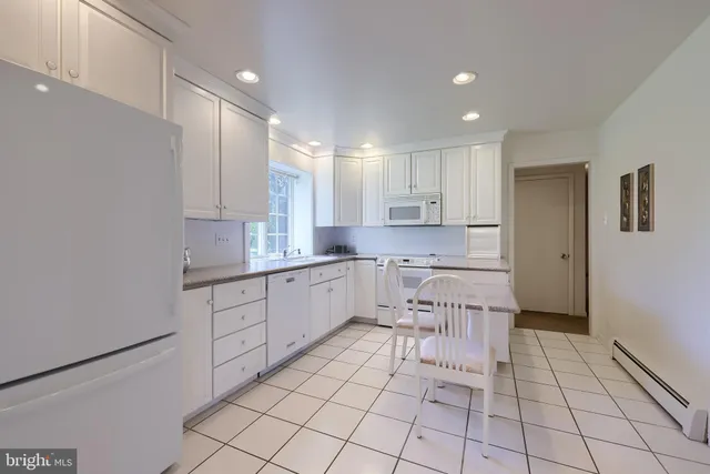 a kitchen with a cabinets and appliances