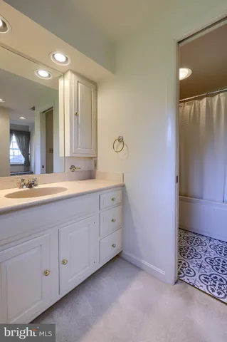 a bathroom with a double vanity sink and mirror