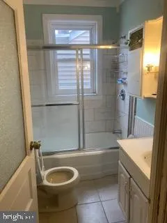 a bathroom with a sink a bathtub and shower