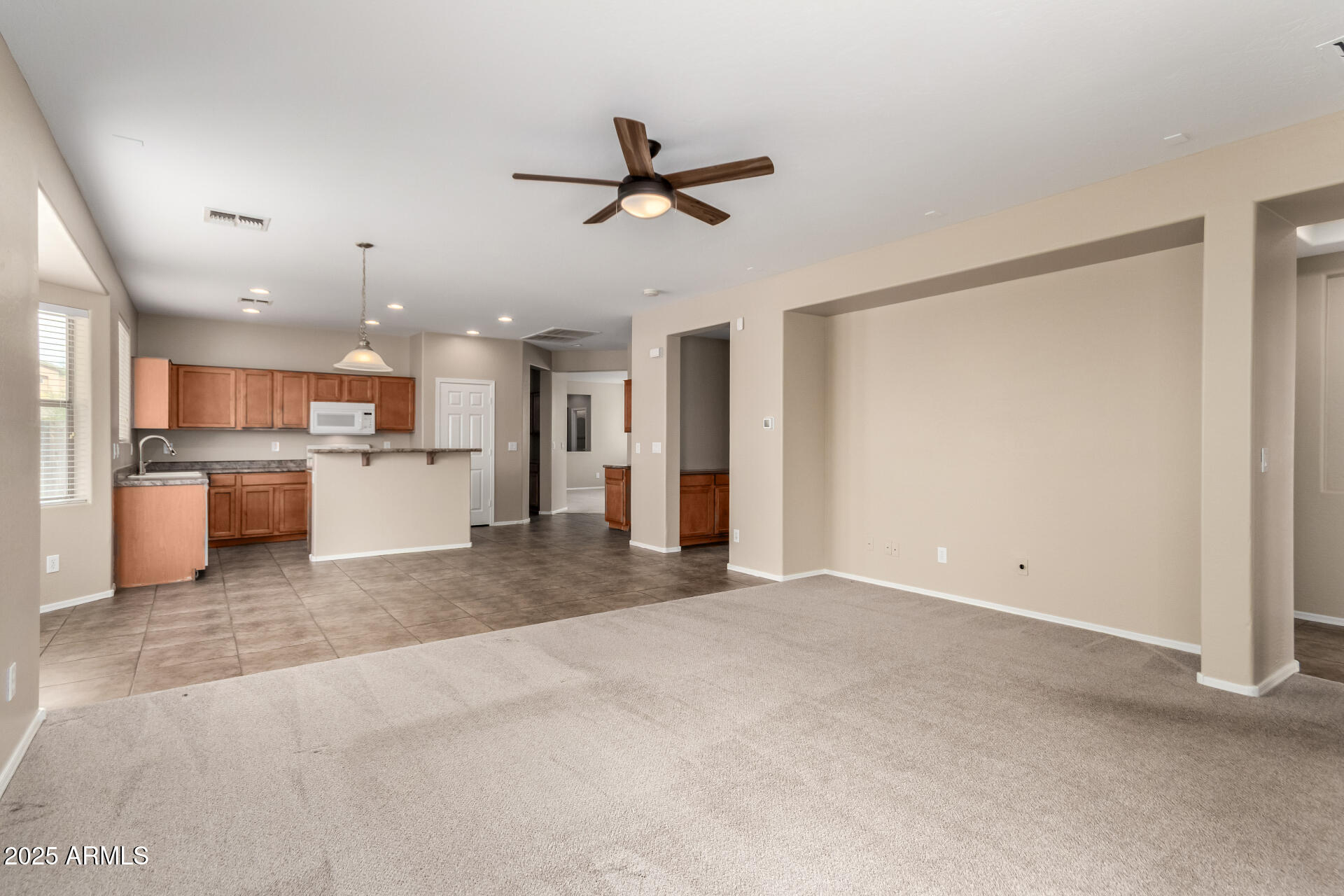 2203 West Vía Caballo Blanco Phoenix, AZ 85085 - Photo 14 of 28 a view of a kitchen with a sink and a refrigerator