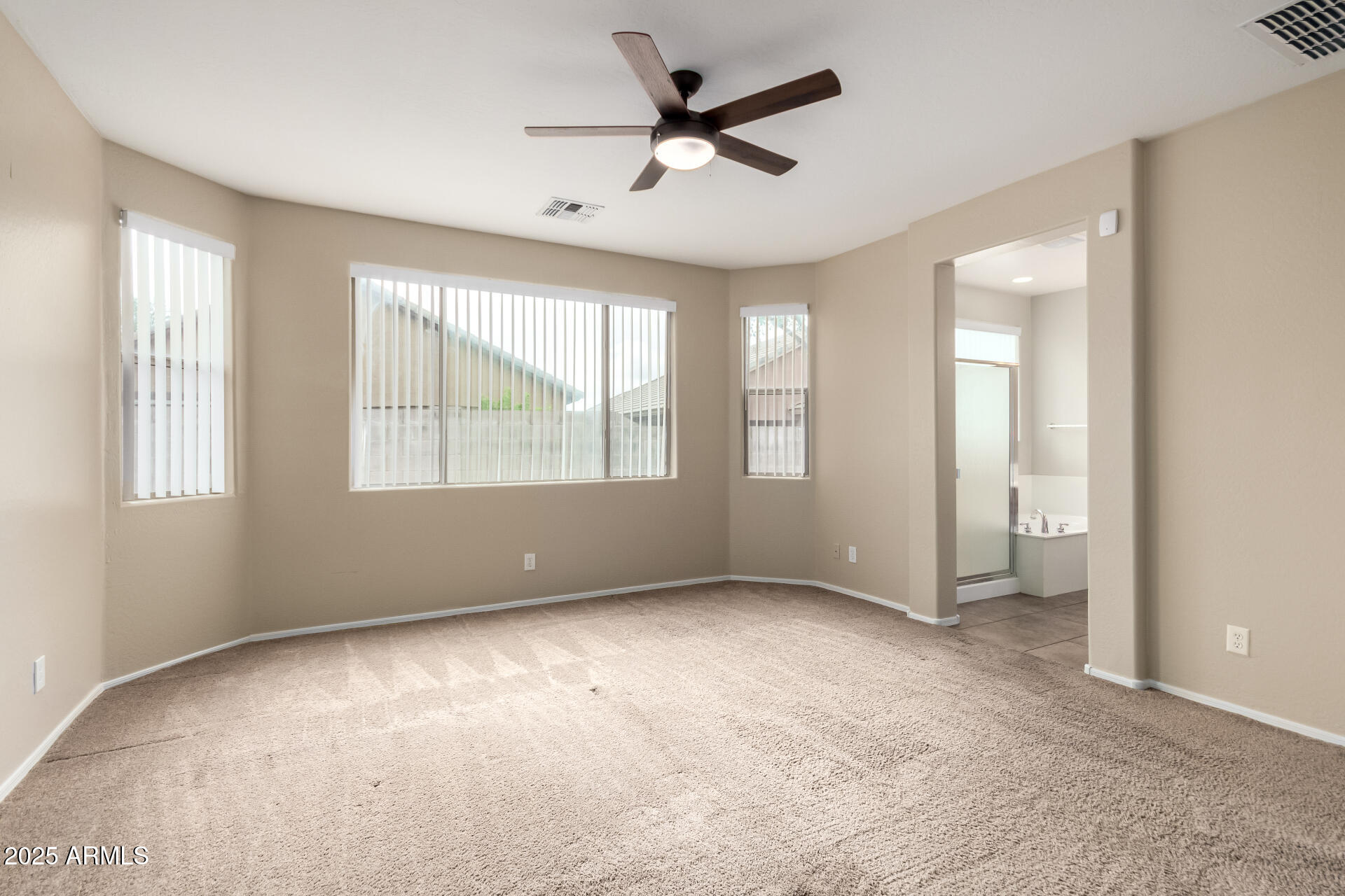 2203 West Vía Caballo Blanco Phoenix, AZ 85085 - Photo 16 of 28 a view of an empty room with a window