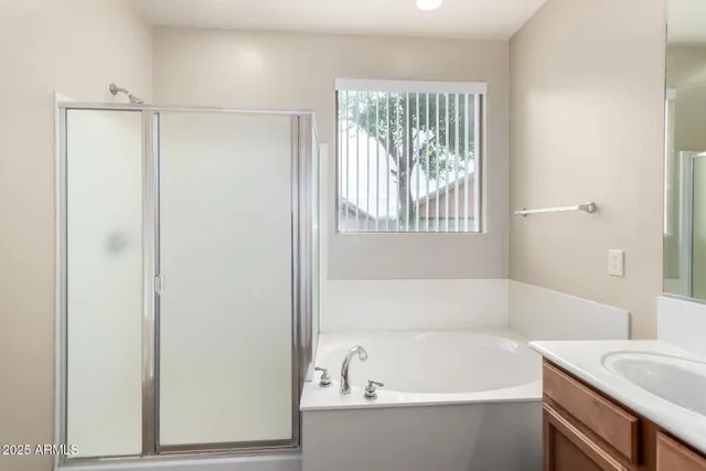 a white bath tub sitting next to a white sink