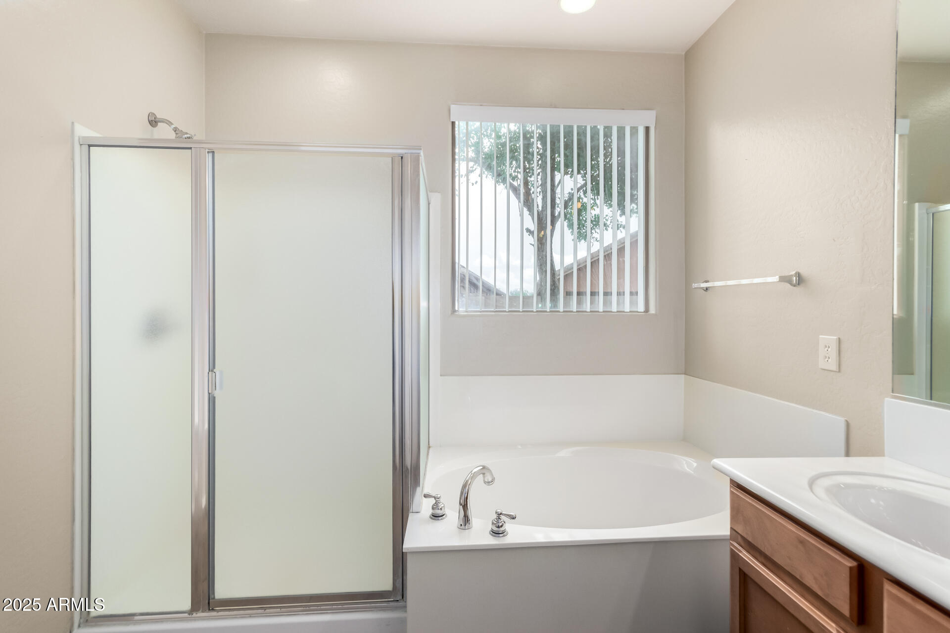 2203 West Vía Caballo Blanco Phoenix, AZ 85085 - Photo 19 of 28 a white bath tub sitting next to a white sink