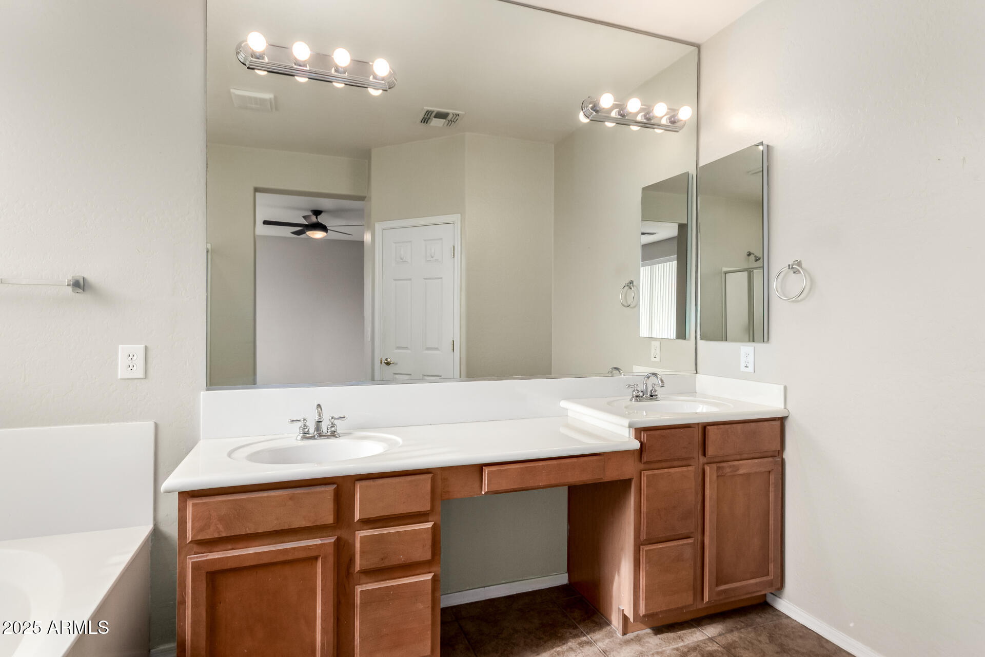2203 West Vía Caballo Blanco Phoenix, AZ 85085 - Photo 20 of 28 a bathroom with a sink vanity and a mirror