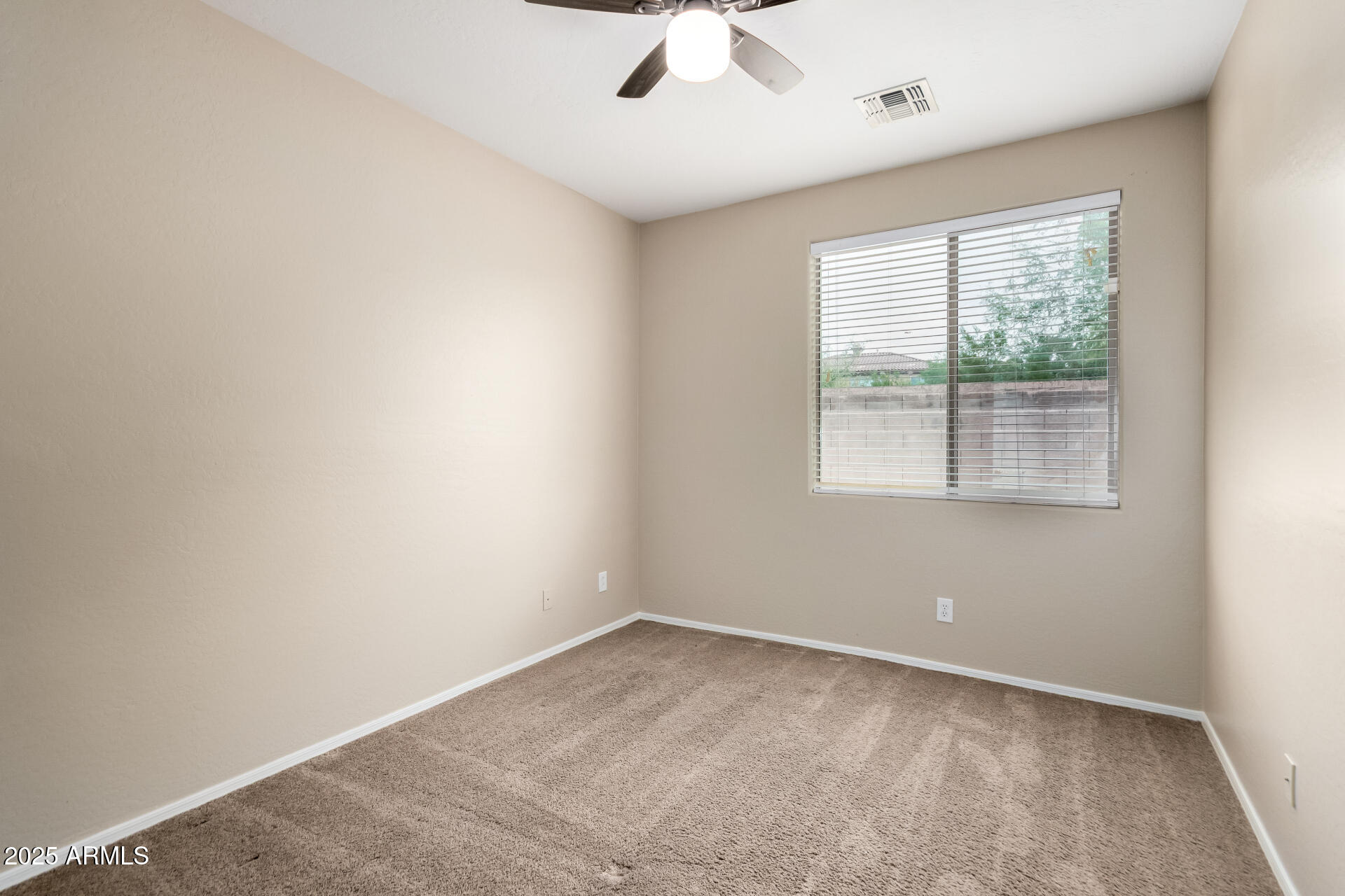 2203 West Vía Caballo Blanco Phoenix, AZ 85085 - Photo 21 of 28 an empty room with a window
