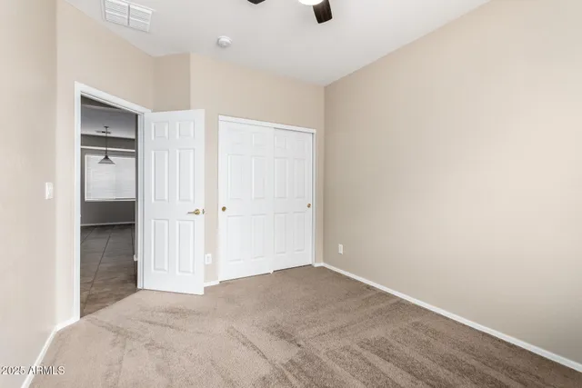 a view of a big room with wooden floor and cabinet