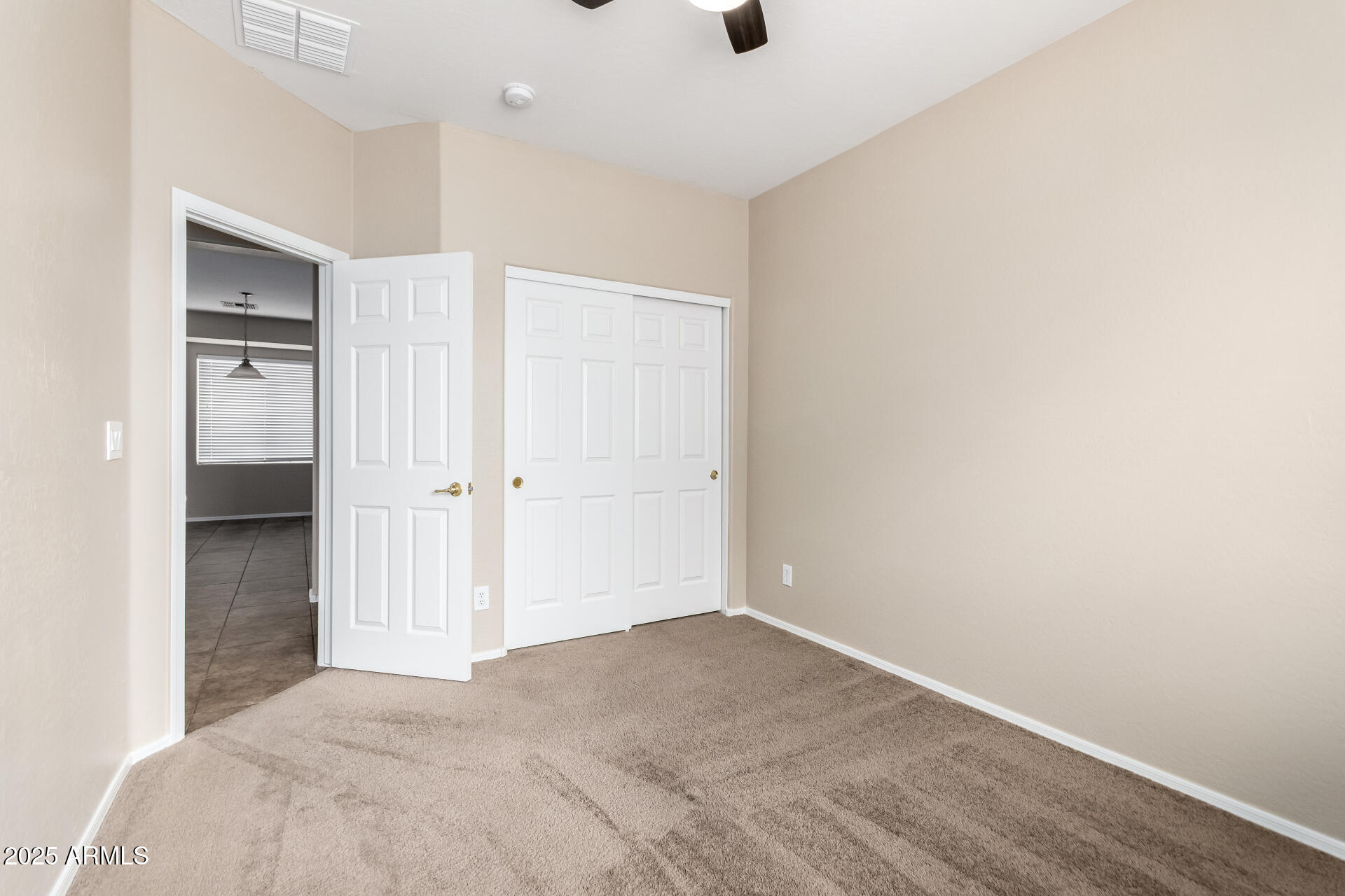 2203 West Vía Caballo Blanco Phoenix, AZ 85085 - Photo 22 of 28 a view of a big room with wooden floor and cabinet