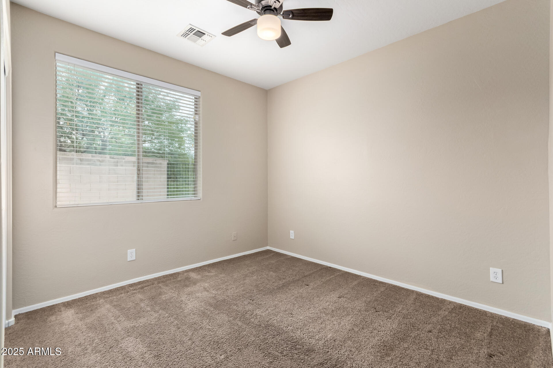 2203 West Vía Caballo Blanco Phoenix, AZ 85085 - Photo 23 of 28 an empty room with a window