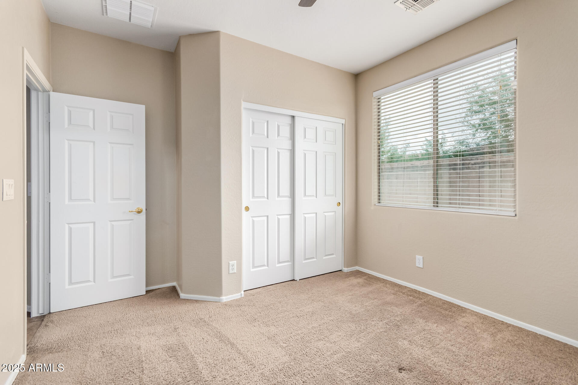 2203 West Vía Caballo Blanco Phoenix, AZ 85085 - Photo 24 of 28 an empty room with windows