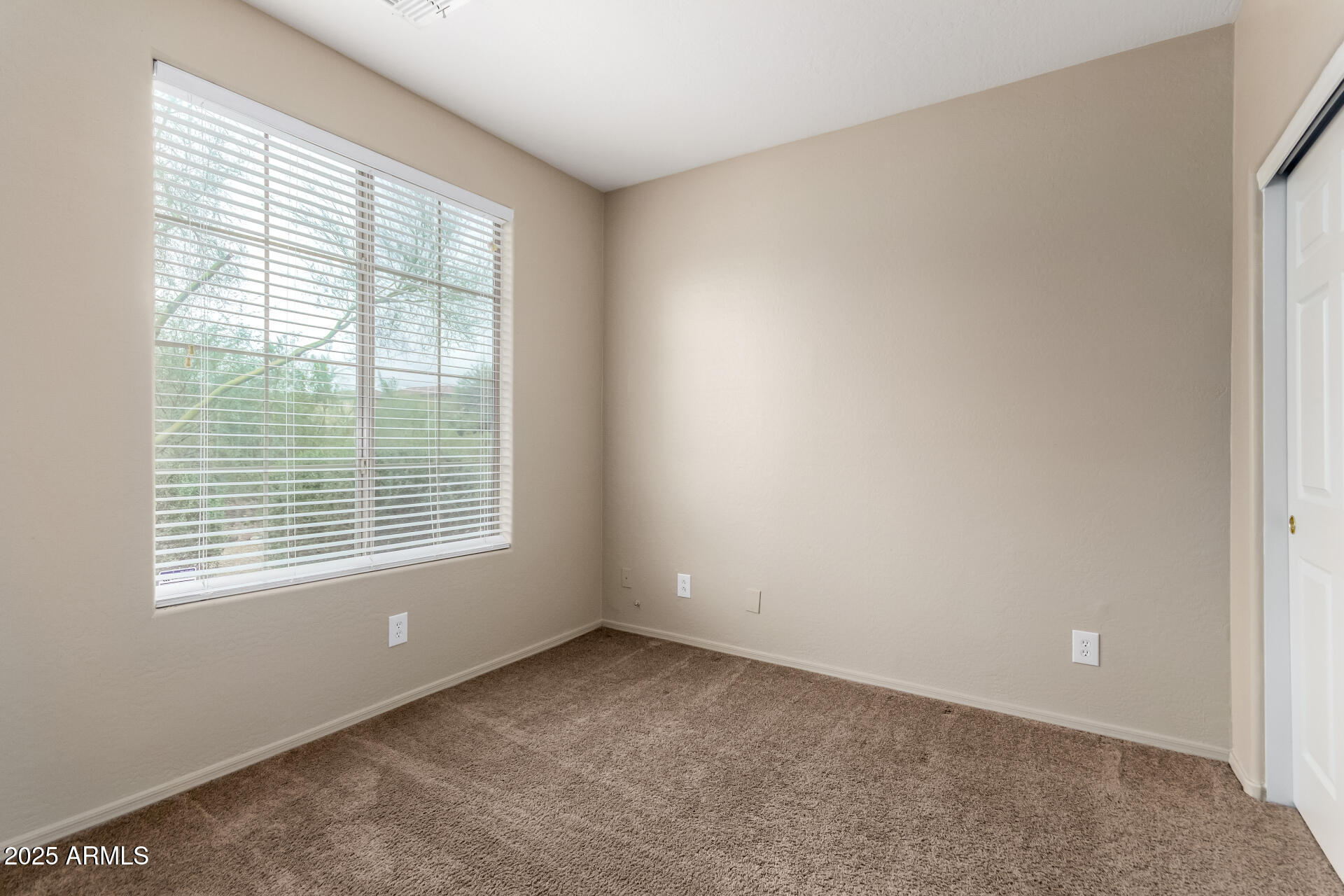 2203 West Vía Caballo Blanco Phoenix, AZ 85085 - Photo 4 of 28 a view of an empty room with a window