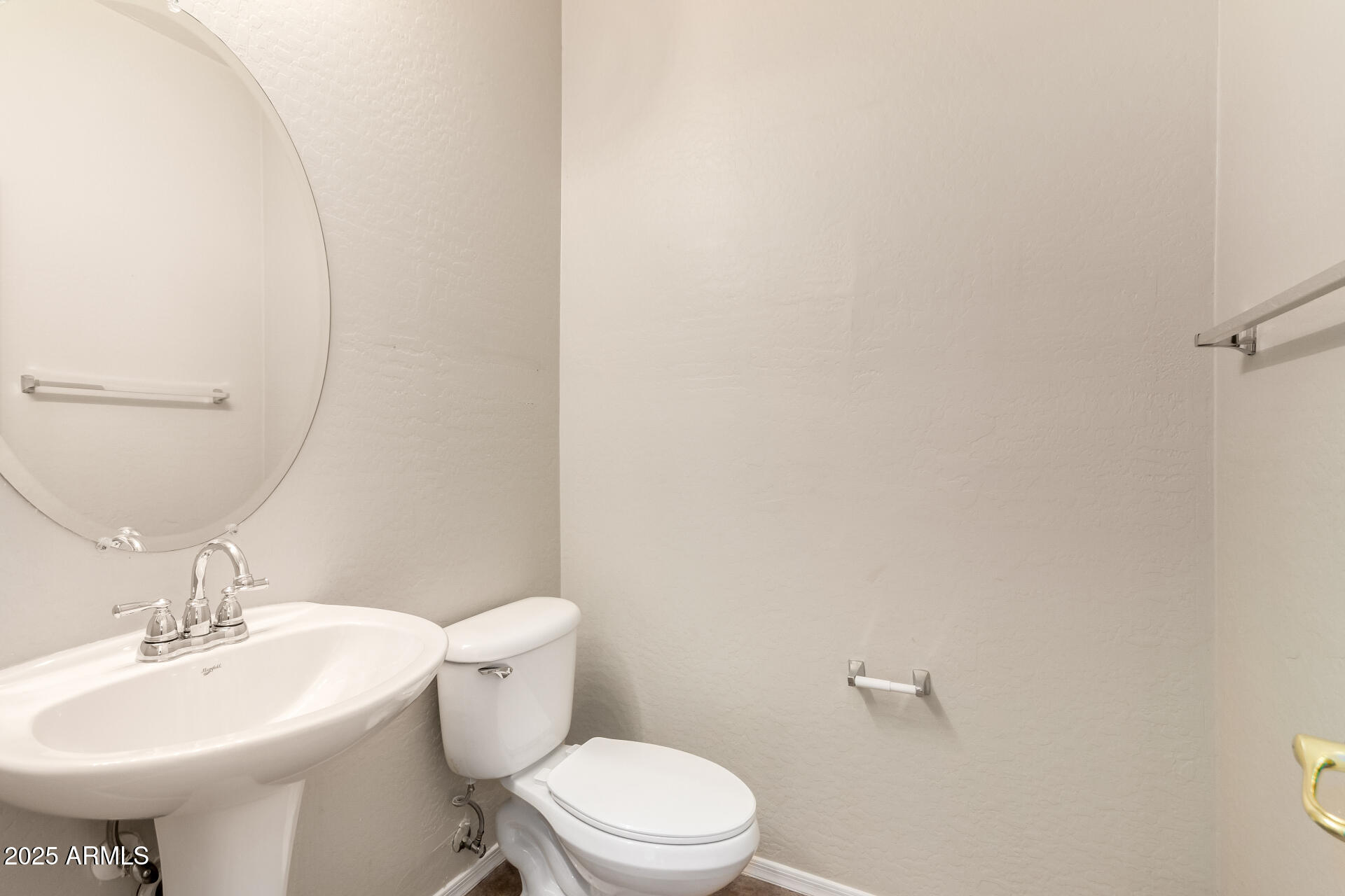 2203 West Vía Caballo Blanco Phoenix, AZ 85085 - Photo 6 of 28 a bathroom with a sink a toilet and mirror