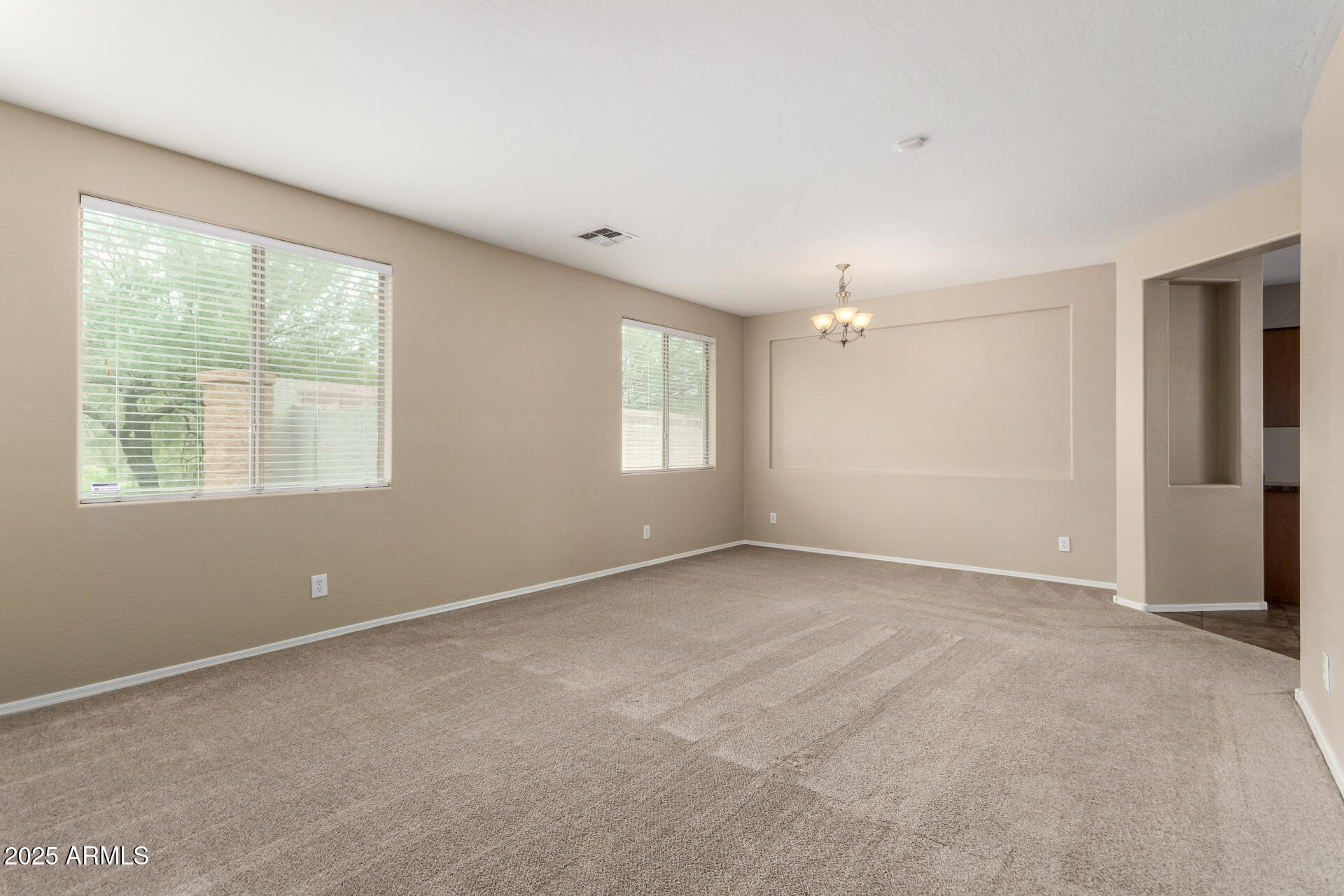 2203 West Vía Caballo Blanco Phoenix, AZ 85085 - Photo 8 of 28 a view of an empty room with a window
