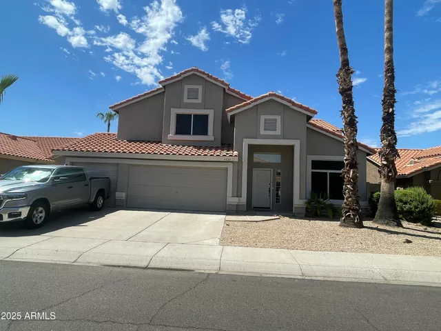 a front view of a house with garage