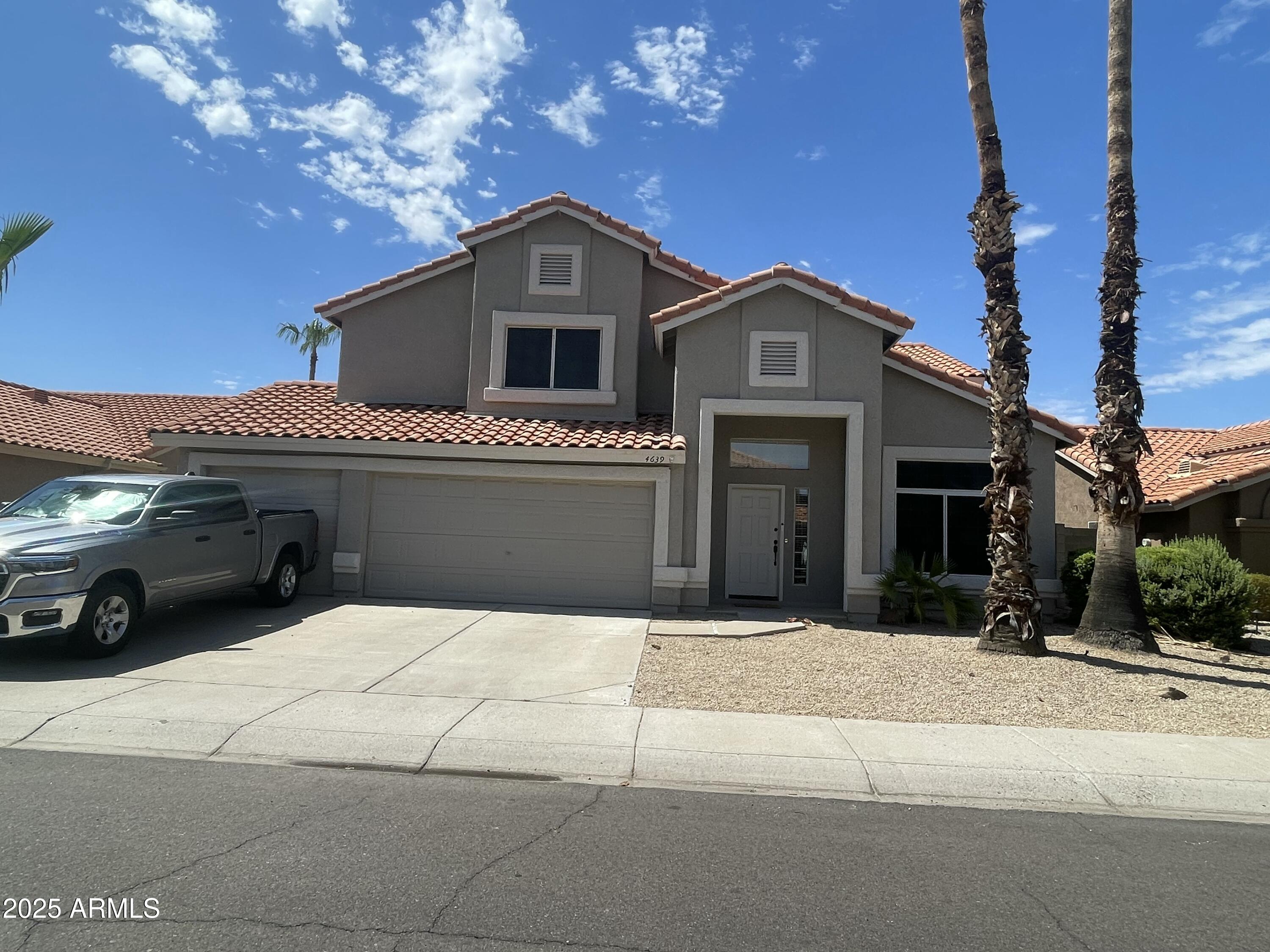 a front view of a house with garage