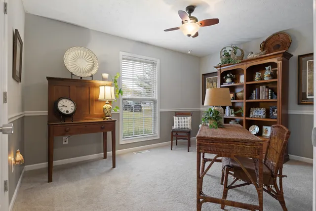 a workspace with furniture and window
