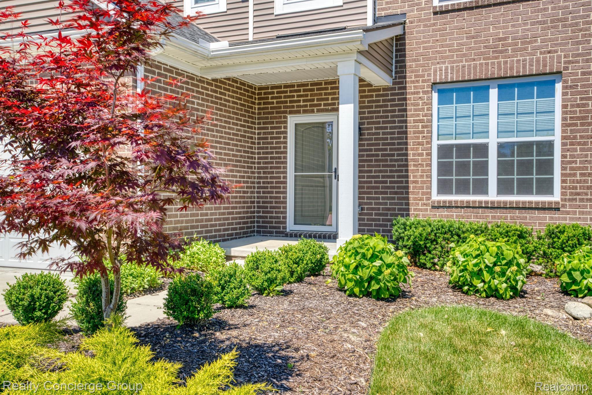 1171 Cannonade Loop Howell, MI 48843 - Photo 23 of 27 Covered front porch & landscaping welcome you home