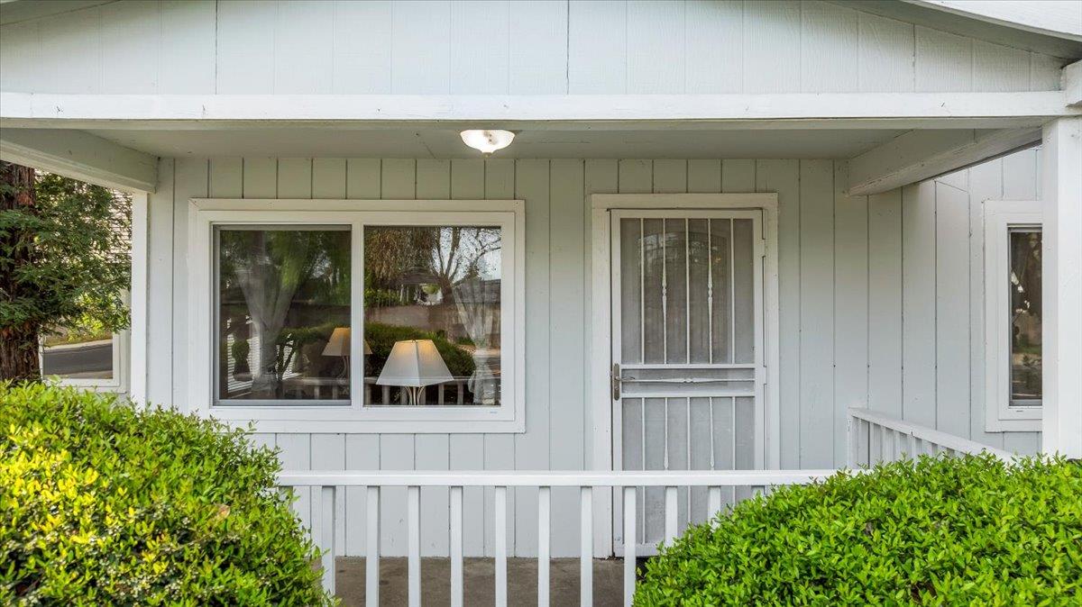 572 Pedersen Road Oakdale, CA 95361 - Photo 6 of 36 front view of a house with a large window and potted plants