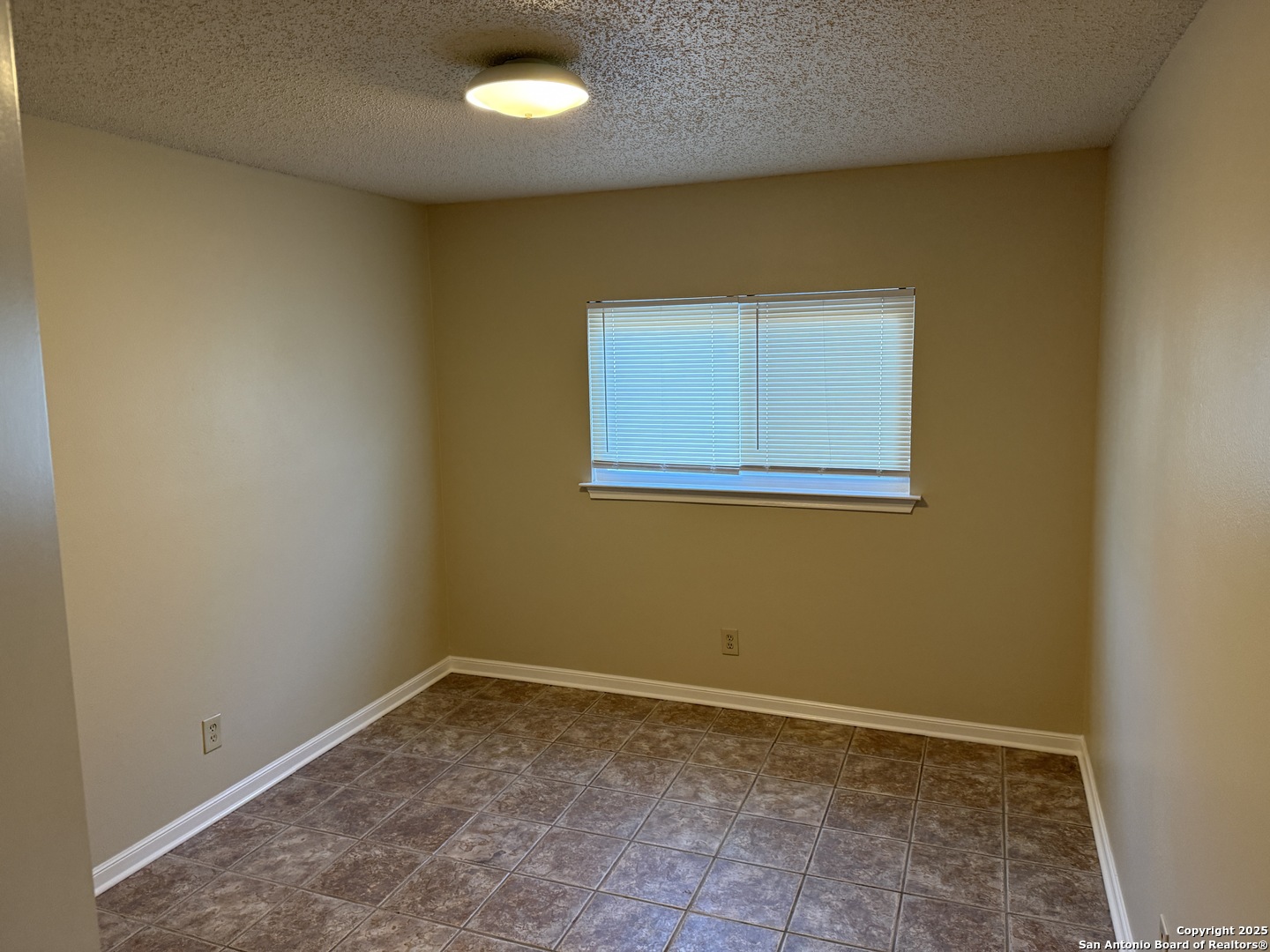 8015 Chestnut Gate Lane Converse, TX 78109 - Photo 15 of 21 an empty room with a empty space and a window