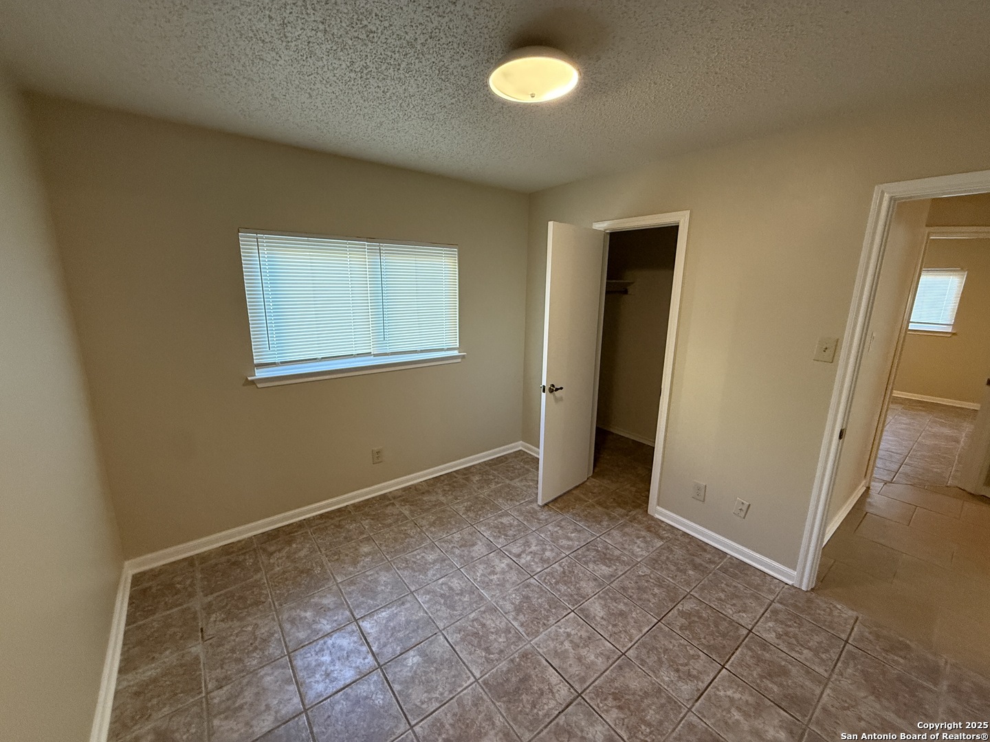 8015 Chestnut Gate Lane Converse, TX 78109 - Photo 18 of 21 an empty room with windows