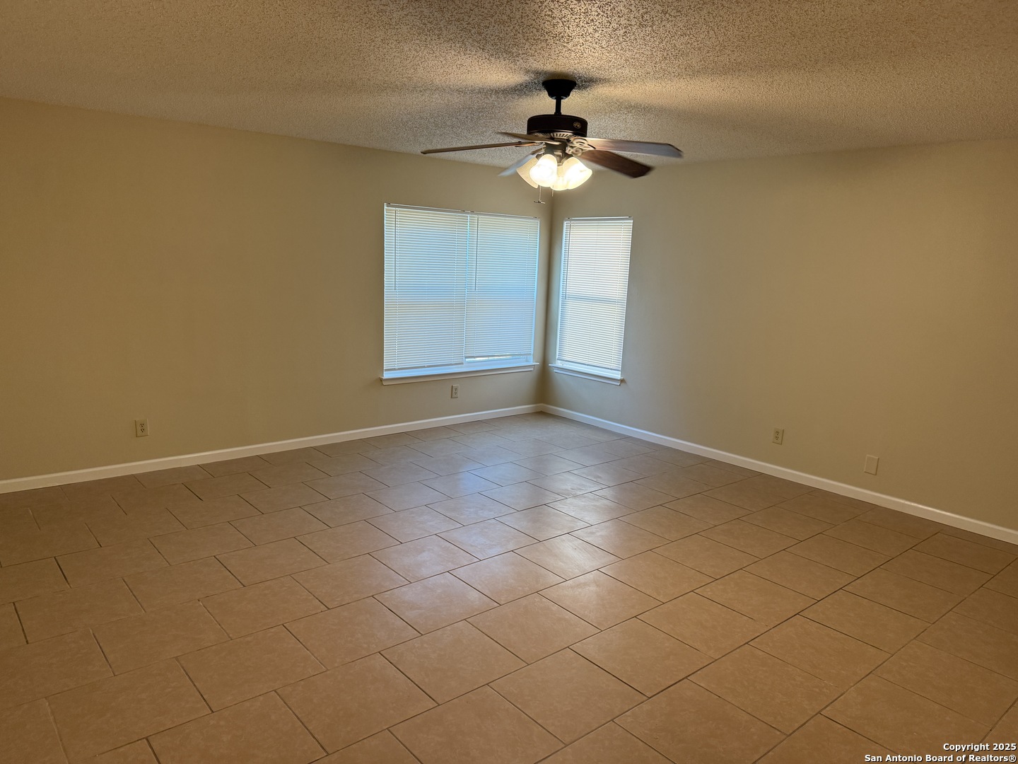 8015 Chestnut Gate Lane Converse, TX 78109 - Photo 6 of 21 a view of an empty room with a chandelier fan