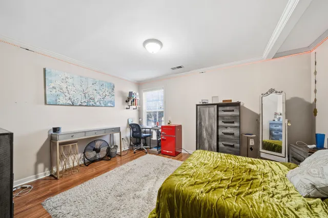 a bed room with a bed and a television