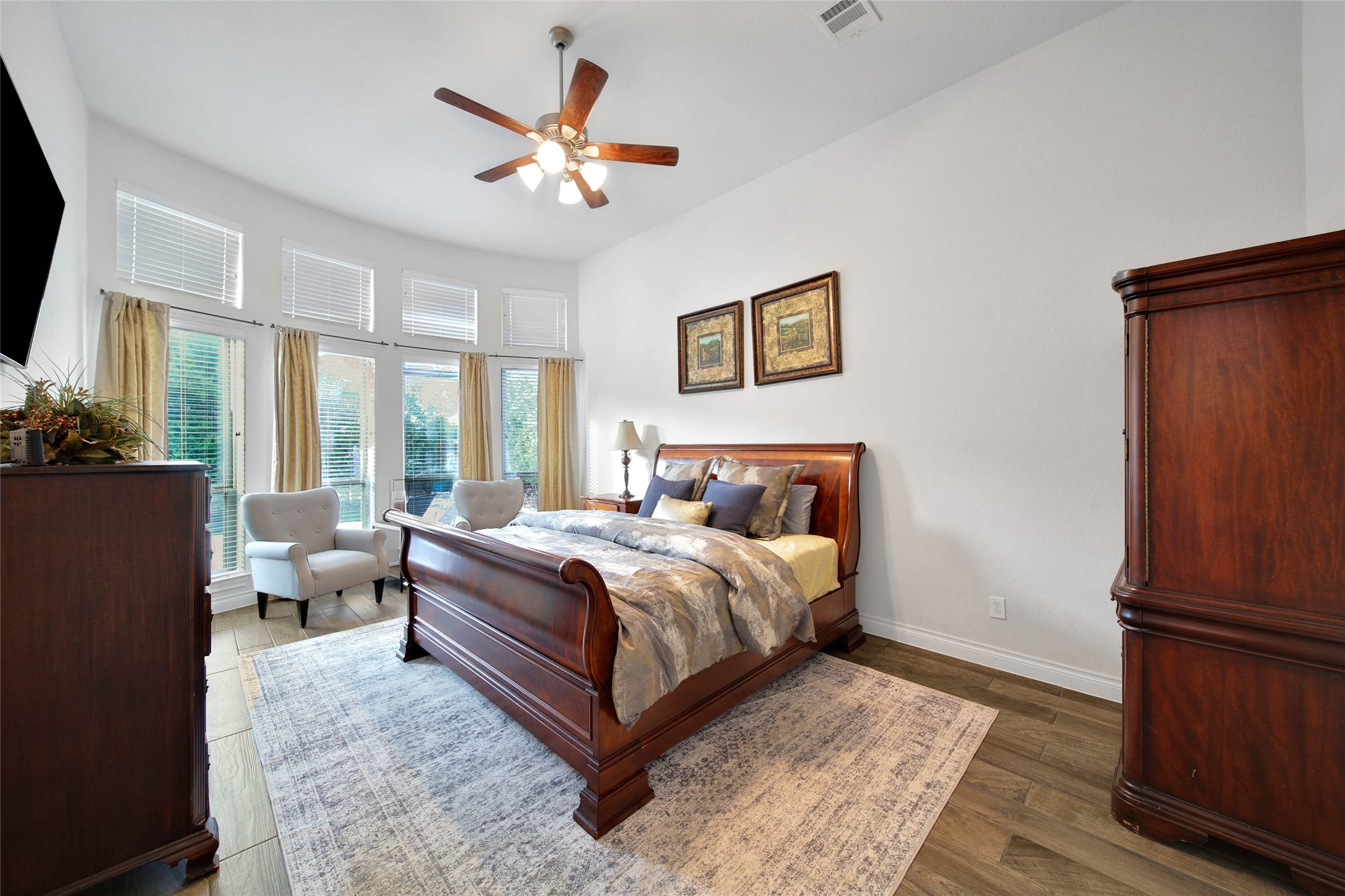 28602 Mountain Timber Court Fulshear, TX 77441 - Photo 22 of 47 Primary Suite is accented by a curved wall of windows.