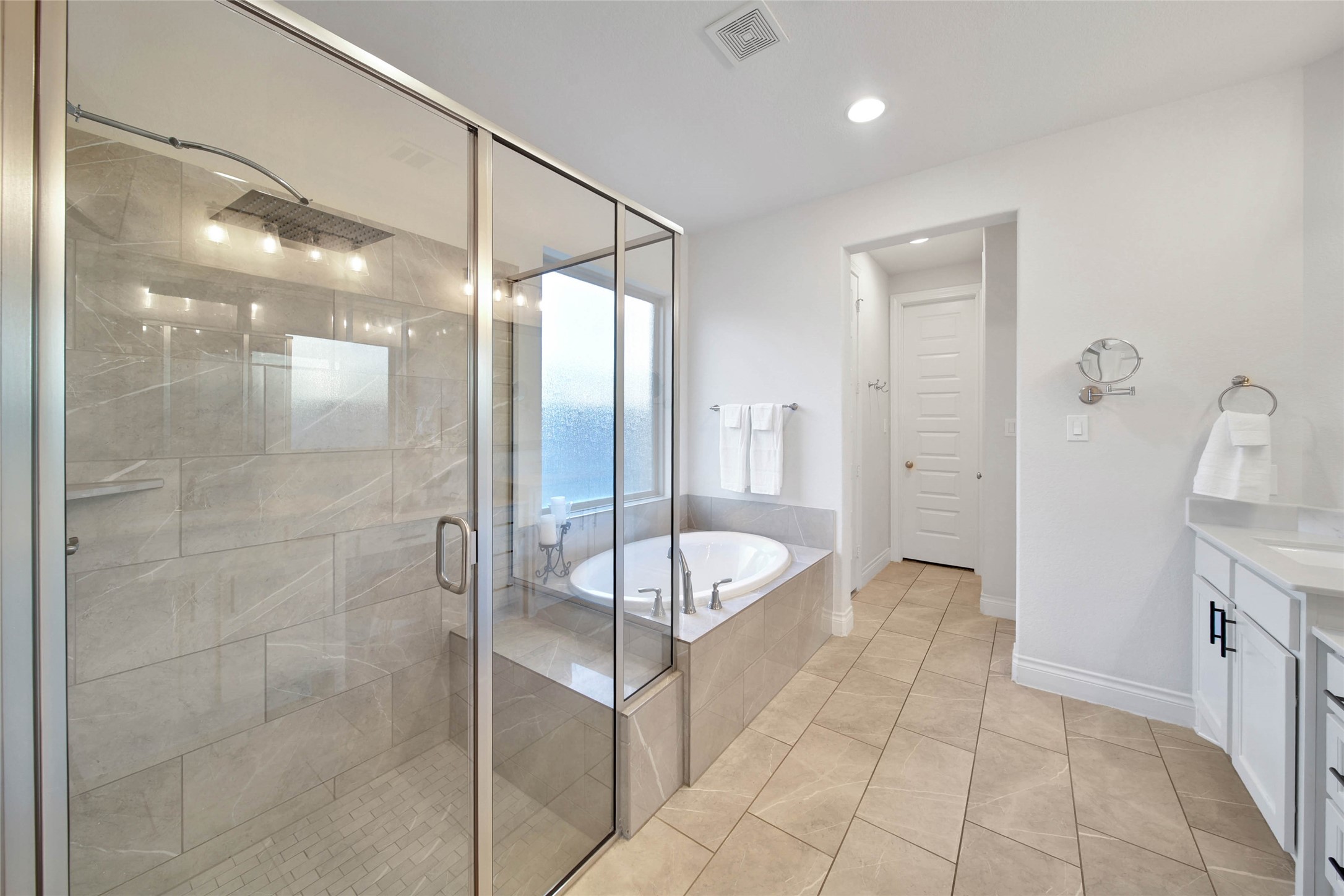 28602 Mountain Timber Court Fulshear, TX 77441 - Photo 24 of 47 The bathroom features an extended shower with bench seating along with a garden tub, perfect for soaking and relaxing.