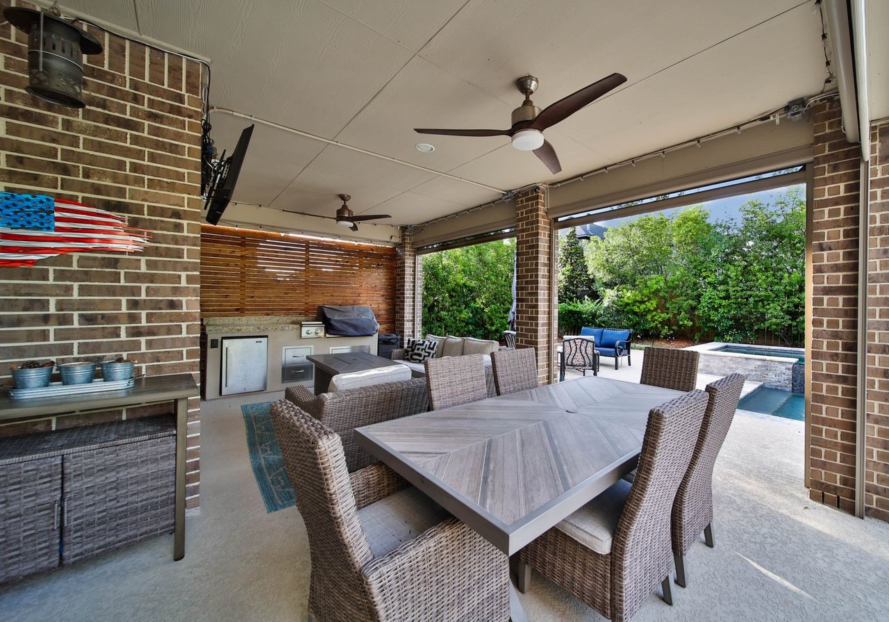 28602 Mountain Timber Court Fulshear, TX 77441 - Photo 36 of 47 This outdoor covered patio with a built-in kitchen is truly EVERYTHING! From everyday moments to weekend gatherings, you’ll find yourself enjoying the space and sharing it with friends and family.