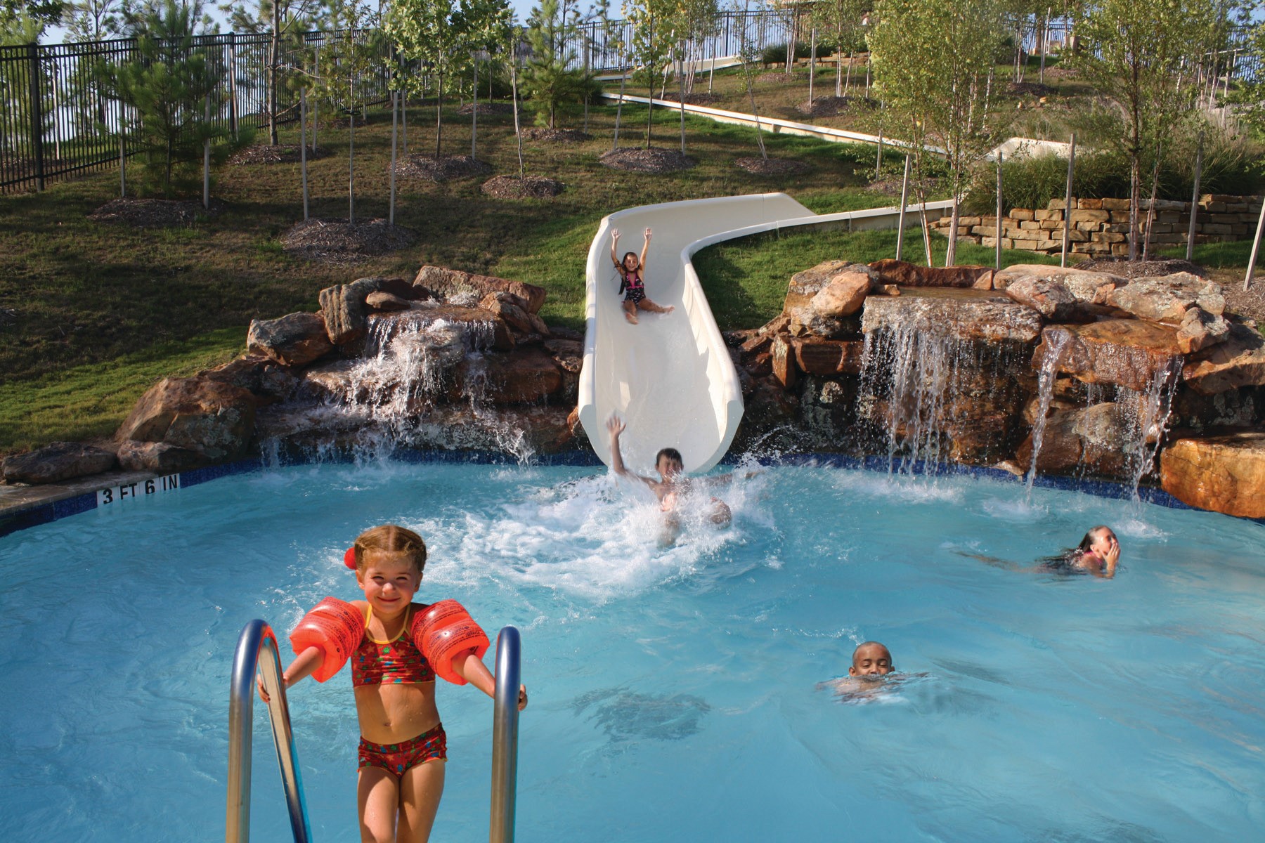 28602 Mountain Timber Court Fulshear, TX 77441 - Photo 45 of 47 From swimming laps to sliding down our 140-foot water slide, soak up fun in the sun at our four pool complexes.