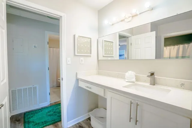 a bathroom with a sink and a mirror