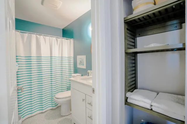 a bathroom with a toilet and a sink