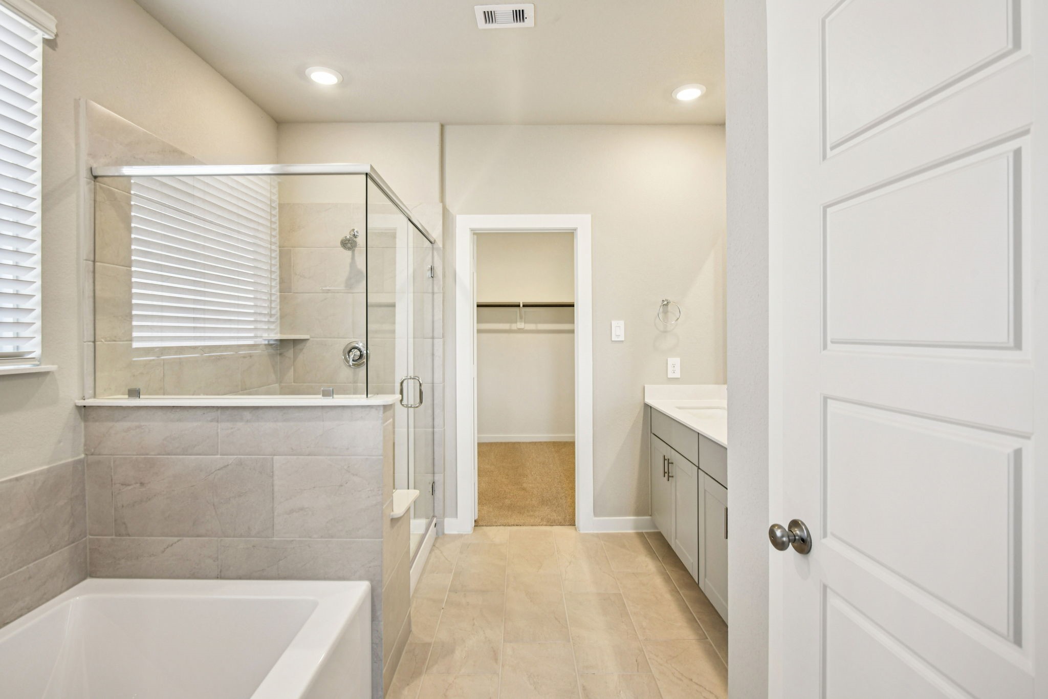 17892 Stone Terrace Montgomery, TX 77316 - Photo 26 of 49 a bathroom with a bathtub and a shower