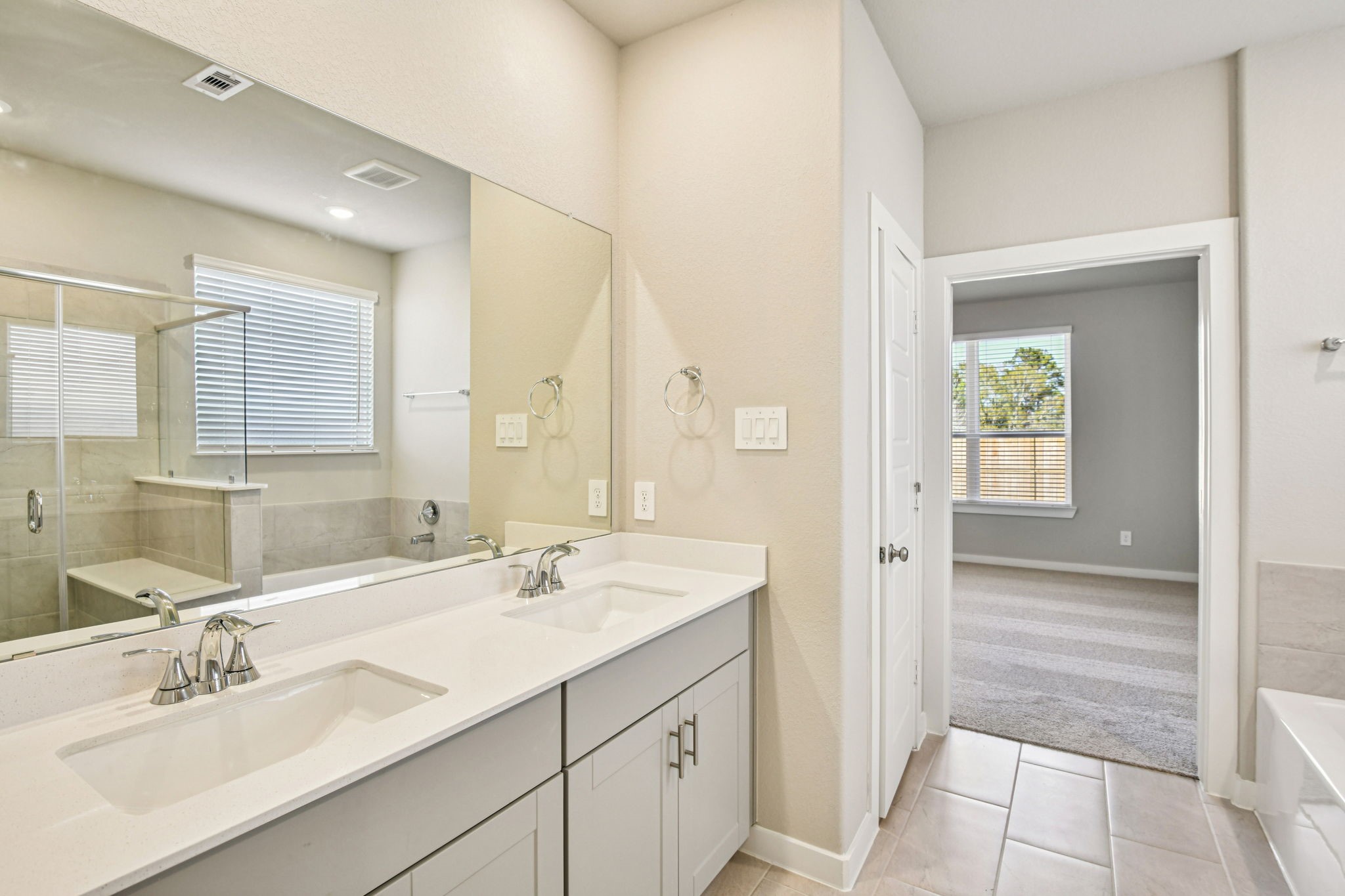 17892 Stone Terrace Montgomery, TX 77316 - Photo 28 of 49 a bathroom with a sink double vanity and a mirror