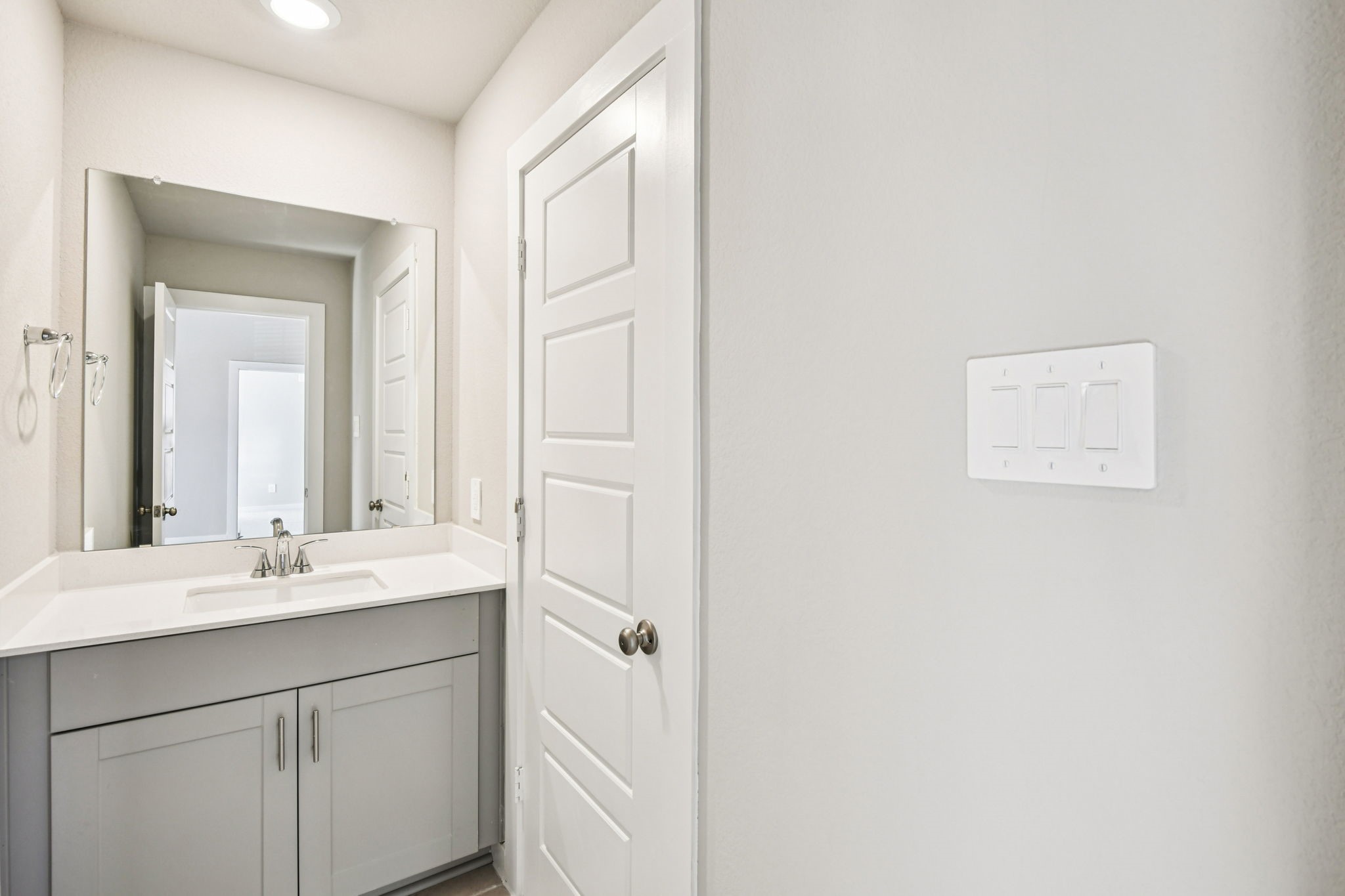 17892 Stone Terrace Montgomery, TX 77316 - Photo 43 of 49 a bathroom with a sink a mirror and a vanity