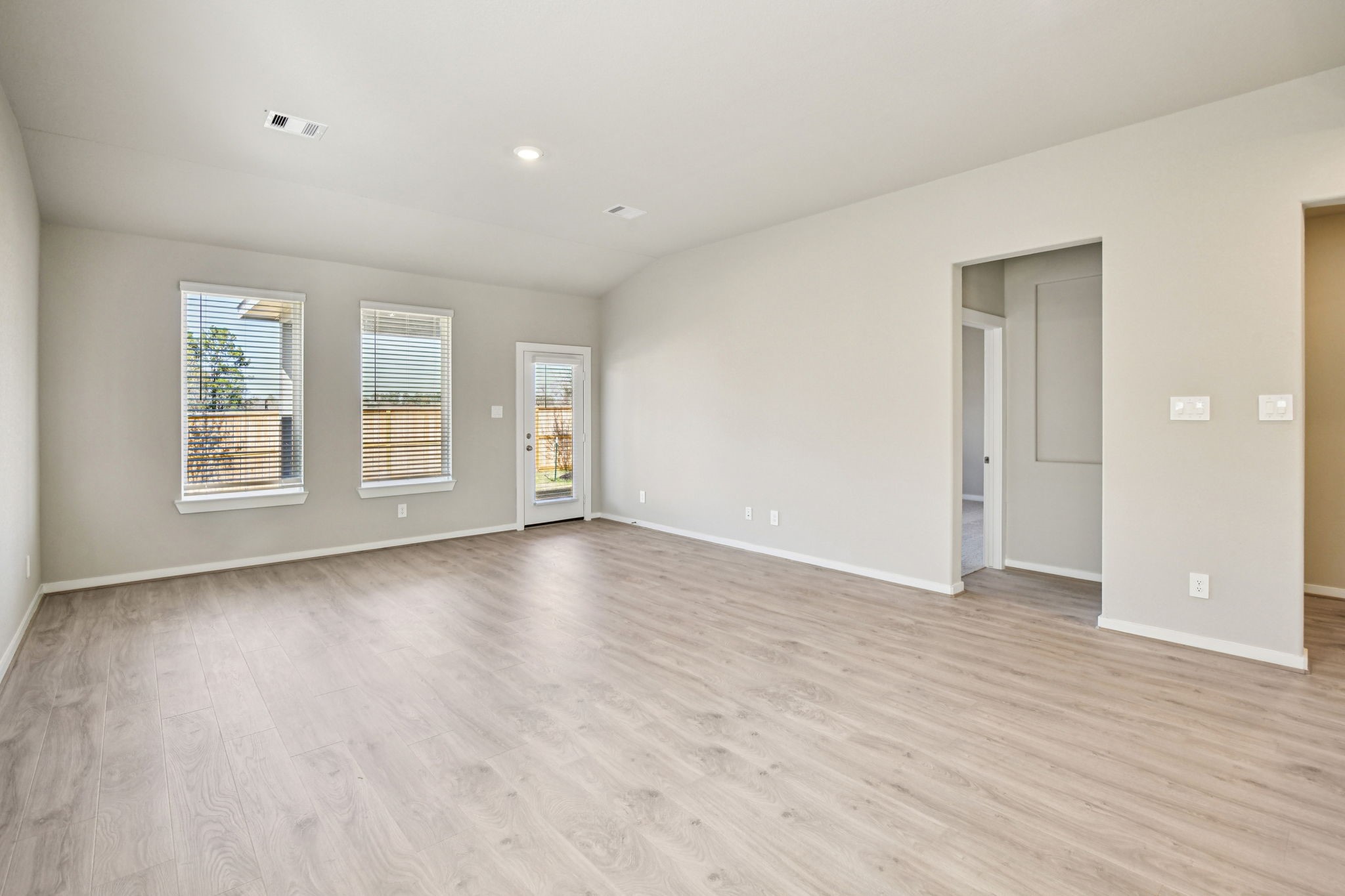 17892 Stone Terrace Montgomery, TX 77316 - Photo 8 of 49 an empty room with wooden floor and windows