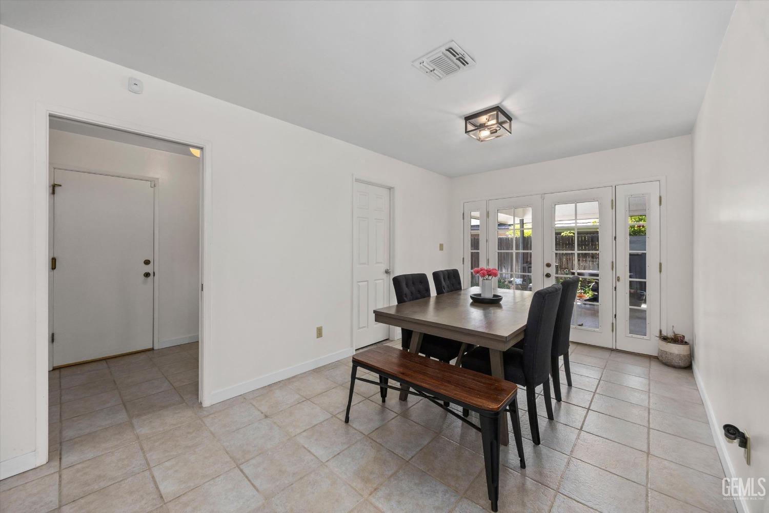 Undisclosed Address Bakersfield, CA 93311 - Photo 11 of 34 a dining room with a table and chairs