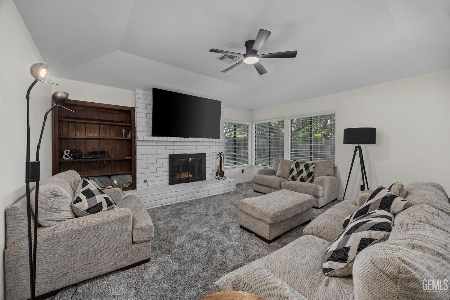 Undisclosed Address Bakersfield, CA 93311 - Photo 12 of 34 a living room with furniture and a fireplace