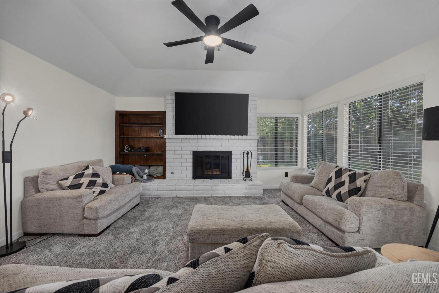 Undisclosed Address Bakersfield, CA 93311 - Photo 13 of 34 a living room with furniture and a fireplace