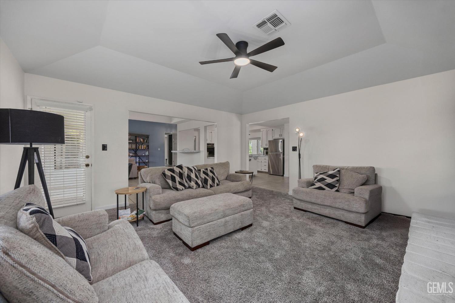 Undisclosed Address Bakersfield, CA 93311 - Photo 15 of 34 a living room with furniture and a ceiling fan