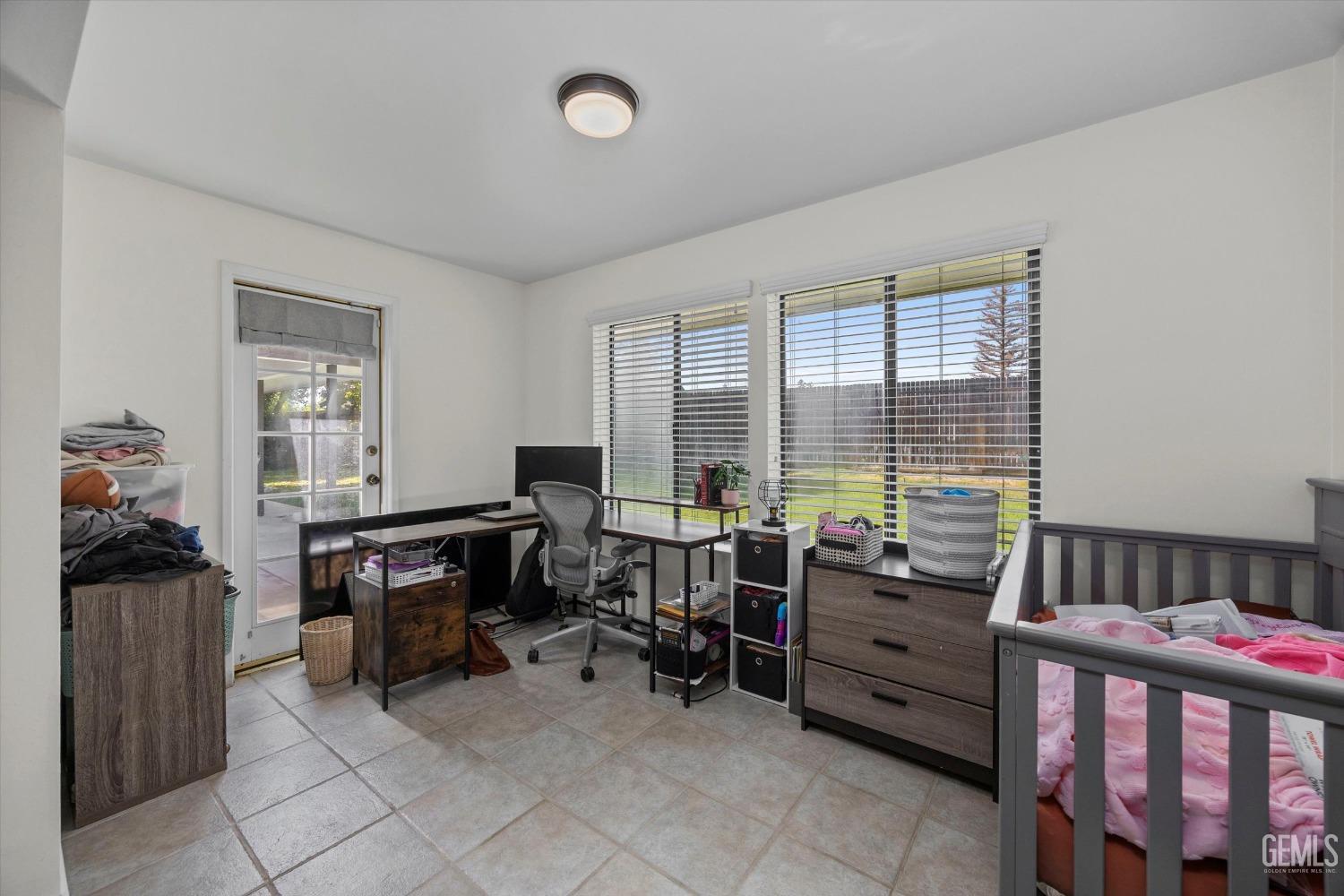 Undisclosed Address Bakersfield, CA 93311 - Photo 21 of 34 a room with furniture and a window