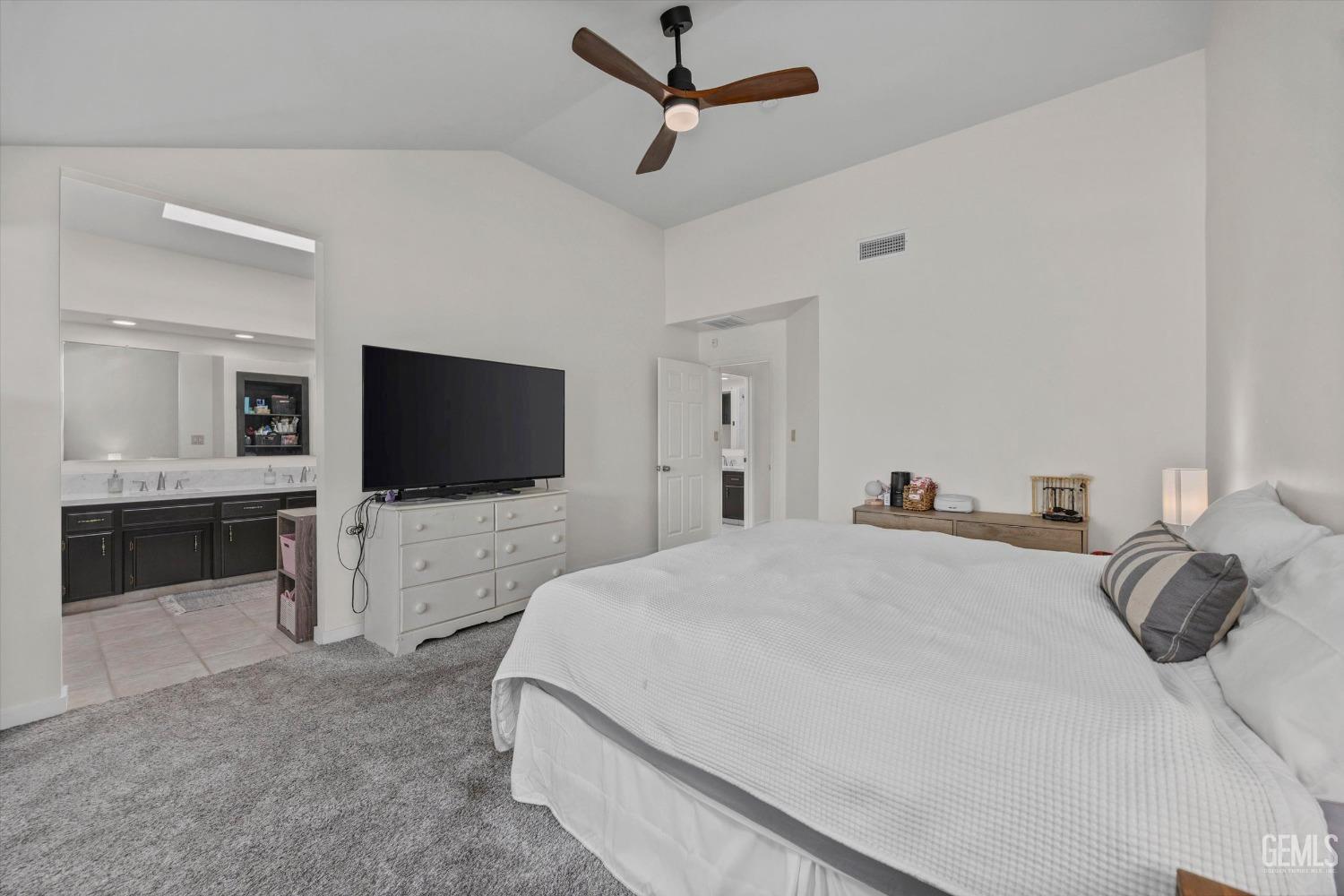 Undisclosed Address Bakersfield, CA 93311 - Photo 22 of 34 a bedroom with a bed and a flat screen tv