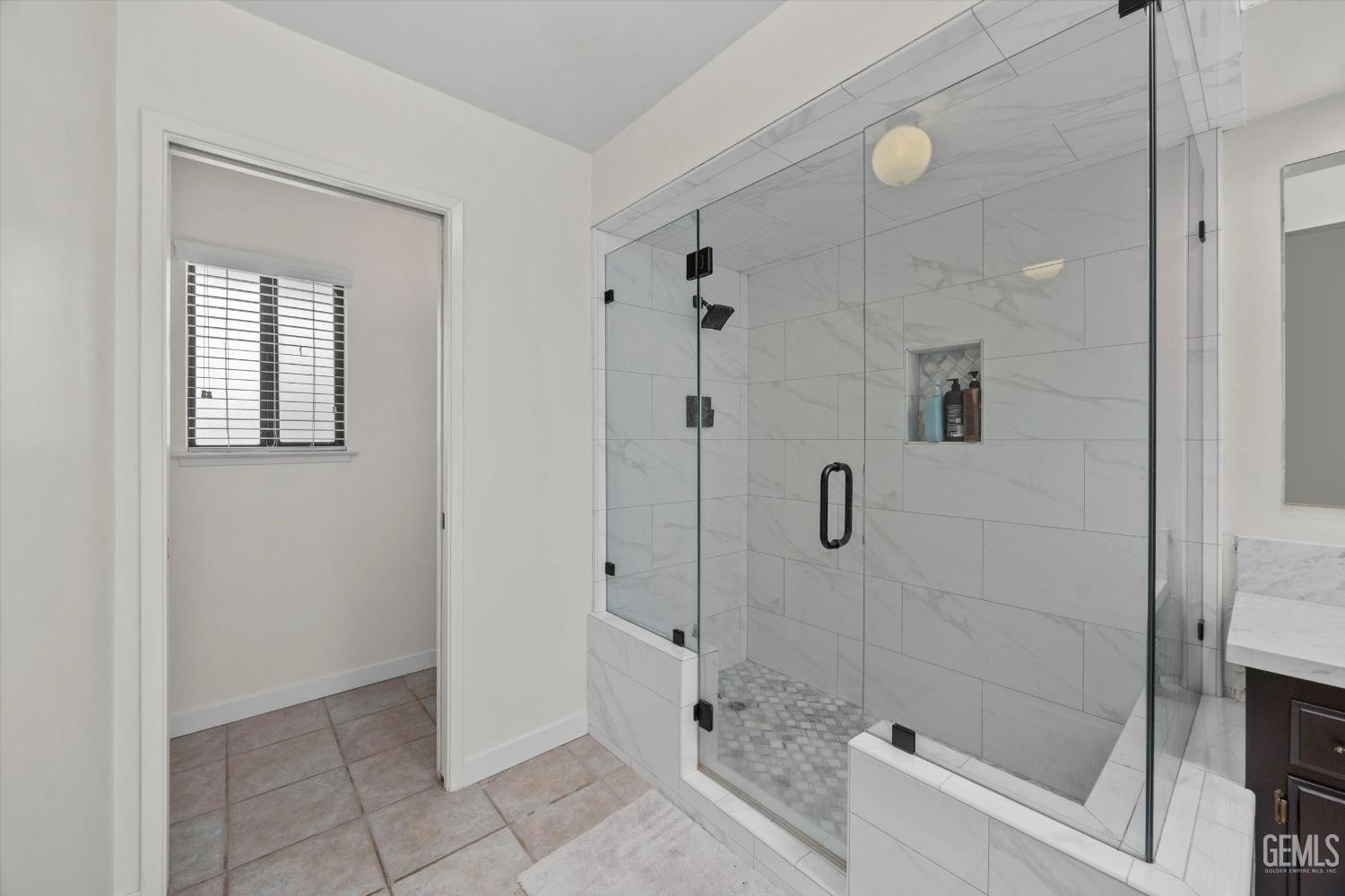 Undisclosed Address Bakersfield, CA 93311 - Photo 24 of 34 a bathroom with a shower and a sink
