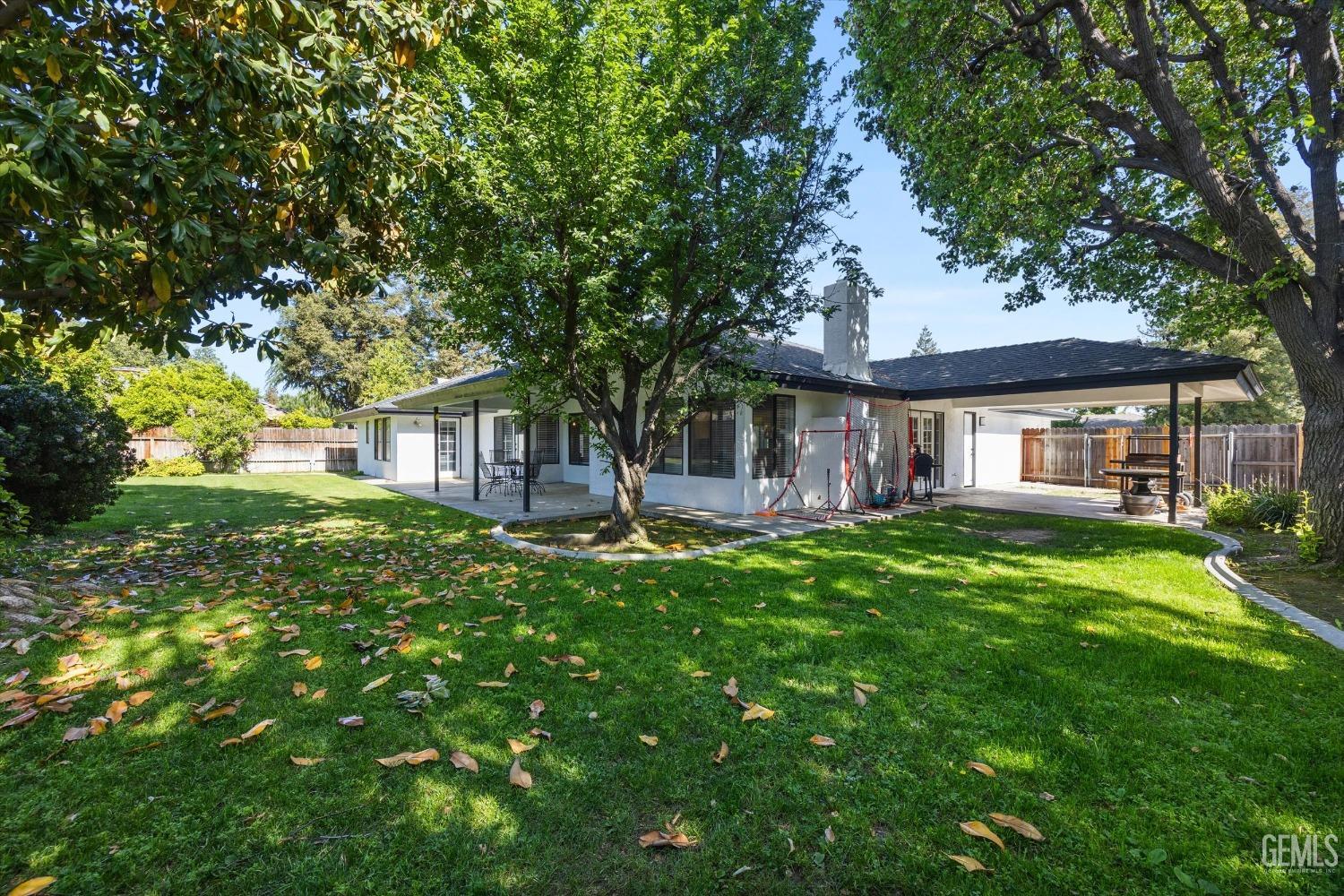 Undisclosed Address Bakersfield, CA 93311 - Photo 31 of 34 a front view of a house with yard and green space