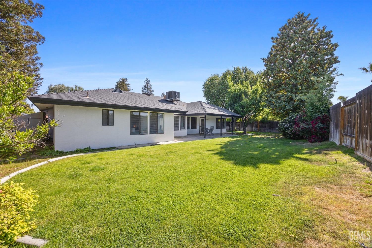 Undisclosed Address Bakersfield, CA 93311 - Photo 32 of 34 a view of a house with swimming pool and a yard