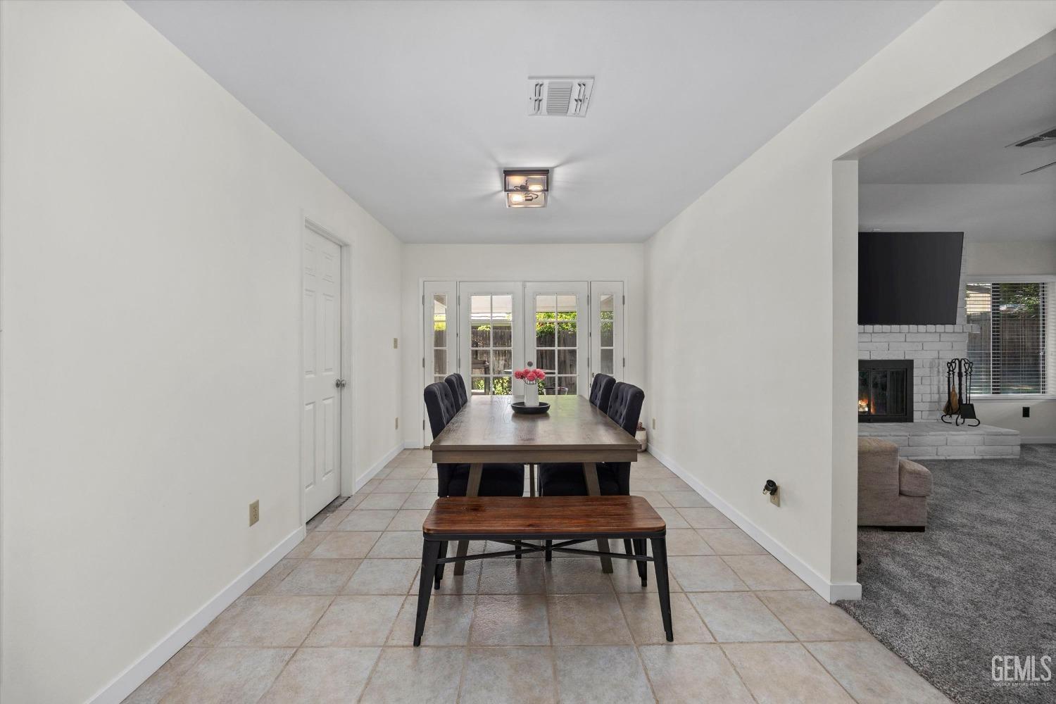 Undisclosed Address Bakersfield, CA 93311 - Photo 10 of 34 a dining room with a table and chairs