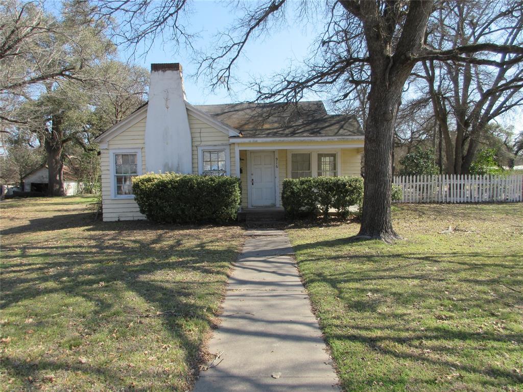 916 Ward Street Marlin, TX 76661 - Photo 1 of 13 a front view of a house with a garden