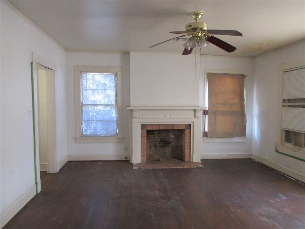 916 Ward Street Marlin, TX 76661 - Photo 8 of 13 a view of empty room with fireplace and fan