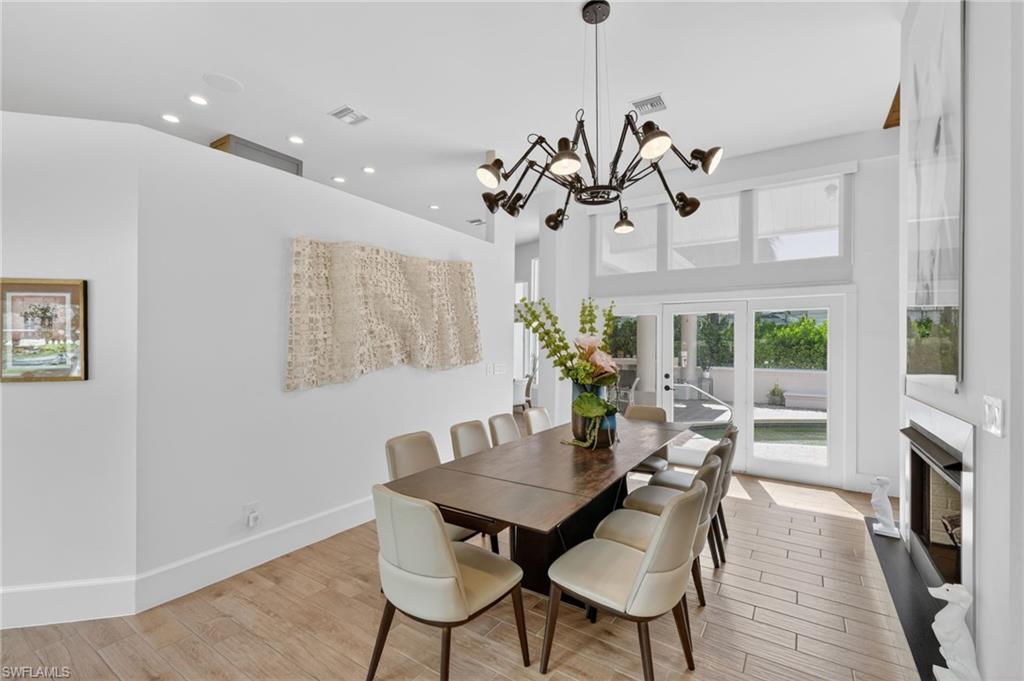 175 Palm River Boulevard Naples, FL 34110 - Photo 14 of 45 a view of a dining room with furniture window and outside view