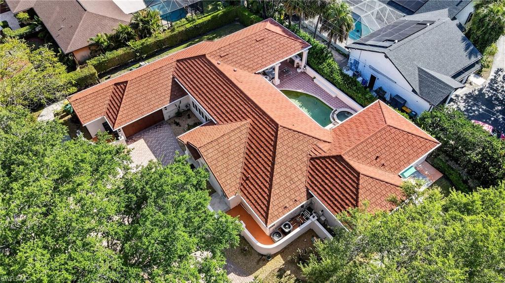 175 Palm River Boulevard Naples, FL 34110 - Photo 2 of 45 an aerial view of a house with garden space and street view